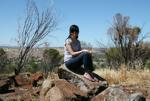 Sonya sitting on Mount Ommanney Hill