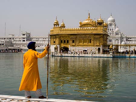 Sikh man in traditional dress and turban at the Golden Temple