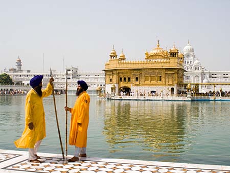 Two Sikh men wearing royal blue turbans common among Sikh ministers and gyanis