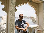 Travis at Jag Mandir Palace and City Palace in the distance
