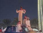 Man dancing on car roof