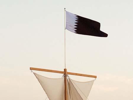 Entrance to the exhibition, Qatar flag on sails