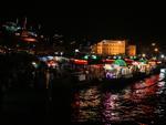 Floating restaurants selling fish sandwiches at night